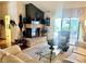 Bright living room featuring a brick fireplace, hardwood floors, and furniture at 2820 Bluff Point Dr, Las Vegas, NV 89134