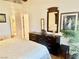 Bright main bedroom with a dresser and views leading to the main bathroom at 2820 Bluff Point Dr, Las Vegas, NV 89134