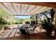 Cozy covered patio featuring a dining set, perfect for enjoying outdoor meals and relaxation at 2820 Bluff Point Dr, Las Vegas, NV 89134