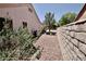 The side yard offers a private area with desert landscaping and block wall at 2820 Bluff Point Dr, Las Vegas, NV 89134