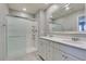 Bright bathroom featuring double sink vanity with white marble tops and stand-up shower at 2870 Turnstone Ridge St, Henderson, NV 89044