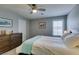 Comfortable bedroom with ceiling fan, a queen-sized bed, and a dresser with decor at 2870 Turnstone Ridge St, Henderson, NV 89044