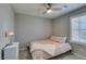 Bedroom features a bed, carpet, and window at 2870 Turnstone Ridge St, Henderson, NV 89044
