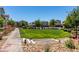 Beautifully maintained community green space with lush landscaping and sidewalks at 2870 Turnstone Ridge St, Henderson, NV 89044