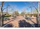 Community park featuring mature trees, picnic benches, manicured grass and walking paths at 2870 Turnstone Ridge St, Henderson, NV 89044