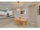 Dining area is adjacent to the kitchen with granite countertop and stainless steel appliances at 2870 Turnstone Ridge St, Henderson, NV 89044