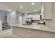Modern kitchen features granite countertops, stainless steel appliances and an open floor plan at 2870 Turnstone Ridge St, Henderson, NV 89044