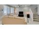 Cozy living room with tile flooring and staircase to the second level at 2870 Turnstone Ridge St, Henderson, NV 89044