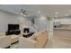 Bright and open living room features tile flooring, a ceiling fan and stairs to the second floor at 2870 Turnstone Ridge St, Henderson, NV 89044