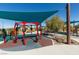 Community play area with unique play structures and shaded seating at 2870 Turnstone Ridge St, Henderson, NV 89044
