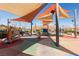 Playground area with colorful equipment, sun shades, and walking paths at 2870 Turnstone Ridge St, Henderson, NV 89044