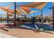 Community playground with modern play equipment and sun shades at 2870 Turnstone Ridge St, Henderson, NV 89044