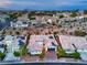 Stunning aerial view of the custom home with colorful tile roof and solar panels in a beautiful neighborhood at 3020 Via Venezia, Henderson, NV 89052