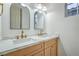 Bathroom featuring a double sink vanity with marble countertop, modern fixtures and decorative mirrors at 3020 Via Venezia, Henderson, NV 89052