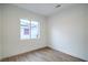Bright bedroom with wood laminate flooring, clean lines, and a large window offer a tranquil retreat at 3020 Via Venezia, Henderson, NV 89052