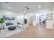 Spacious living room with a large sectional sofa, modern decor, and open access to office space at 3020 Via Venezia, Henderson, NV 89052