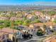 Lovely aerial view of a vibrant neighborhood with lush landscaping and mountain views at 3050 Whispering Crest Dr, Henderson, NV 89052