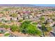 Aerial view of a desert community, highlighting a park with green space and the home's location at 3050 Whispering Crest Dr, Henderson, NV 89052