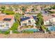 Aerial view of a home featuring a backyard pool, solar panels, and mature landscaping at 3050 Whispering Crest Dr, Henderson, NV 89052
