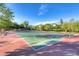 Full basketball court with multiple hoops and well-maintained surface in a community park at 3050 Whispering Crest Dr, Henderson, NV 89052
