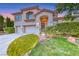 Attractive home featuring a well-kept lawn, mature landscaping, and a convenient two-car garage at 3050 Whispering Crest Dr, Henderson, NV 89052