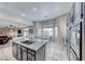 Spacious open kitchen with island, granite countertops, and stainless steel appliances at 3050 Whispering Crest Dr, Henderson, NV 89052