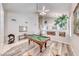 Open-concept living room features a billiard table, high ceilings, and stylish furnishings at 3050 Whispering Crest Dr, Henderson, NV 89052