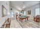 Spacious living area featuring a billiard table, wood floors, and ample natural light at 3050 Whispering Crest Dr, Henderson, NV 89052