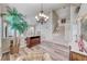 Spacious living area showcases stairs, stylish chandelier and an elevated view of the entry at 3050 Whispering Crest Dr, Henderson, NV 89052