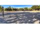 Sandy volleyball court with nets in a community park setting, perfect for outdoor games at 3050 Whispering Crest Dr, Henderson, NV 89052