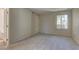 Spacious bedroom featuring neutral carpet, and natural light from large windows at 3145 E Flamingo Rd # 2080, Las Vegas, NV 89121