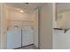 Laundry room featuring a full-size washer and dryer with extra storage space at 3145 E Flamingo Rd # 2080, Las Vegas, NV 89121