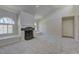 Cozy living room showcasing a fireplace, arched windows, neutral walls, and carpeted floors at 3145 E Flamingo Rd # 2080, Las Vegas, NV 89121
