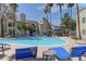 Resort-style community pool with lounge chairs surrounding, perfect for relaxing at 3145 E Flamingo Rd # 2080, Las Vegas, NV 89121