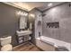 Bathroom featuring a soaking tub, walk-in shower, gray walls and modern floating vanity at 353 E Bonneville Ave # 379, Las Vegas, NV 89101