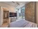 Bedroom with large windows providing ample natural light and city views at 353 E Bonneville Ave # 379, Las Vegas, NV 89101