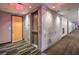 Hallway featuring exit signs and multiple doors that lead to units with safety and privacy at 353 E Bonneville Ave # 379, Las Vegas, NV 89101
