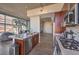 Kitchen with island and seating, stainless steel appliances, and bright window view at 353 E Bonneville Ave # 379, Las Vegas, NV 89101