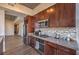 Modern kitchen with stainless steel appliances, wooden cabinets and designer backsplash at 353 E Bonneville Ave # 379, Las Vegas, NV 89101