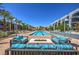 Luxury resort-style pool featuring poolside seating, a fire pit and beautiful desert landscaping at 353 E Bonneville Ave # 379, Las Vegas, NV 89101