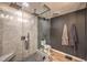 Luxurious walk-in shower featuring a rainfall shower head, pebble floor, and floor-to-ceiling glass at 353 E Bonneville Ave # 379, Las Vegas, NV 89101