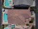 Aerial view of a backyard featuring a pool, patio, and desert landscaping at 4020 Driscoll Mountain St, Las Vegas, NV 89129