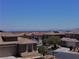 Aerial neighborhood shot showcasing desert landscaping and mountain views in the background at 4020 Driscoll Mountain St, Las Vegas, NV 89129
