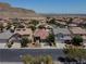 Aerial view of a neighborhood showcasing the property's location with mountain views at 4020 Driscoll Mountain St, Las Vegas, NV 89129