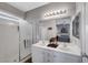 Bright bathroom featuring double sinks, vanity and a glass shower at 4020 Driscoll Mountain St, Las Vegas, NV 89129