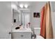 Bathroom features a single sink vanity with framed mirror and shower-tub combination at 4020 Driscoll Mountain St, Las Vegas, NV 89129