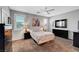 Comfortable bedroom featuring a ceiling fan, neutral colored walls, and natural light at 4020 Driscoll Mountain St, Las Vegas, NV 89129