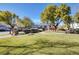 Landscaped common area featuring mature trees, and a circular path at 4020 Driscoll Mountain St, Las Vegas, NV 89129