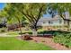 Well maintained common area with park bench, mature landscaping, and walking path at 4020 Driscoll Mountain St, Las Vegas, NV 89129