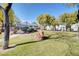 Well-maintained common area with green lawns, trees, and walking paths at 4020 Driscoll Mountain St, Las Vegas, NV 89129